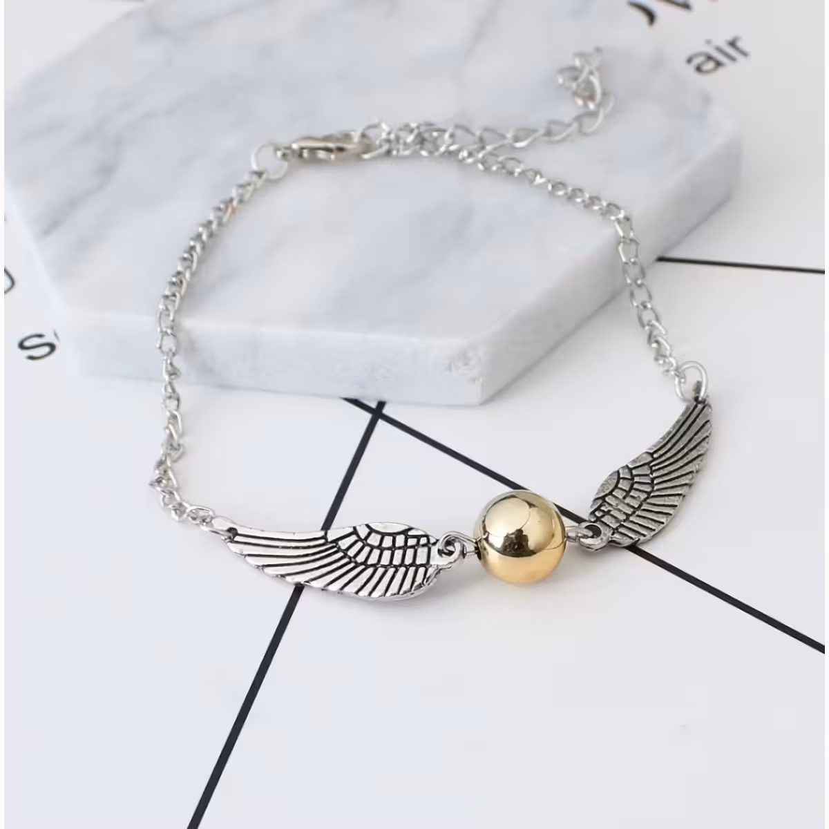 Sidabrinis aksesuaras su Haris Poterio simboliais